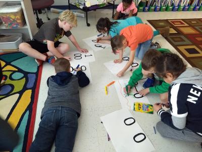 students working on a numbers activity